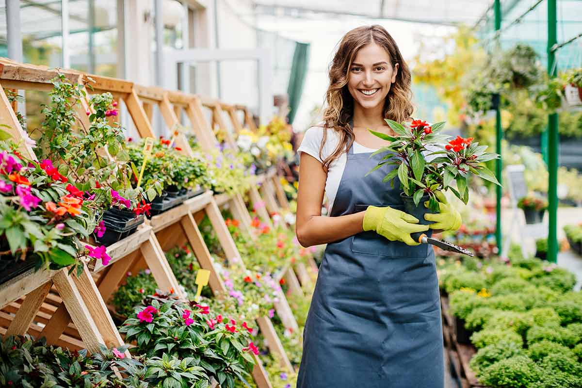 female garden shop owner smiling, guide to cash flow statements